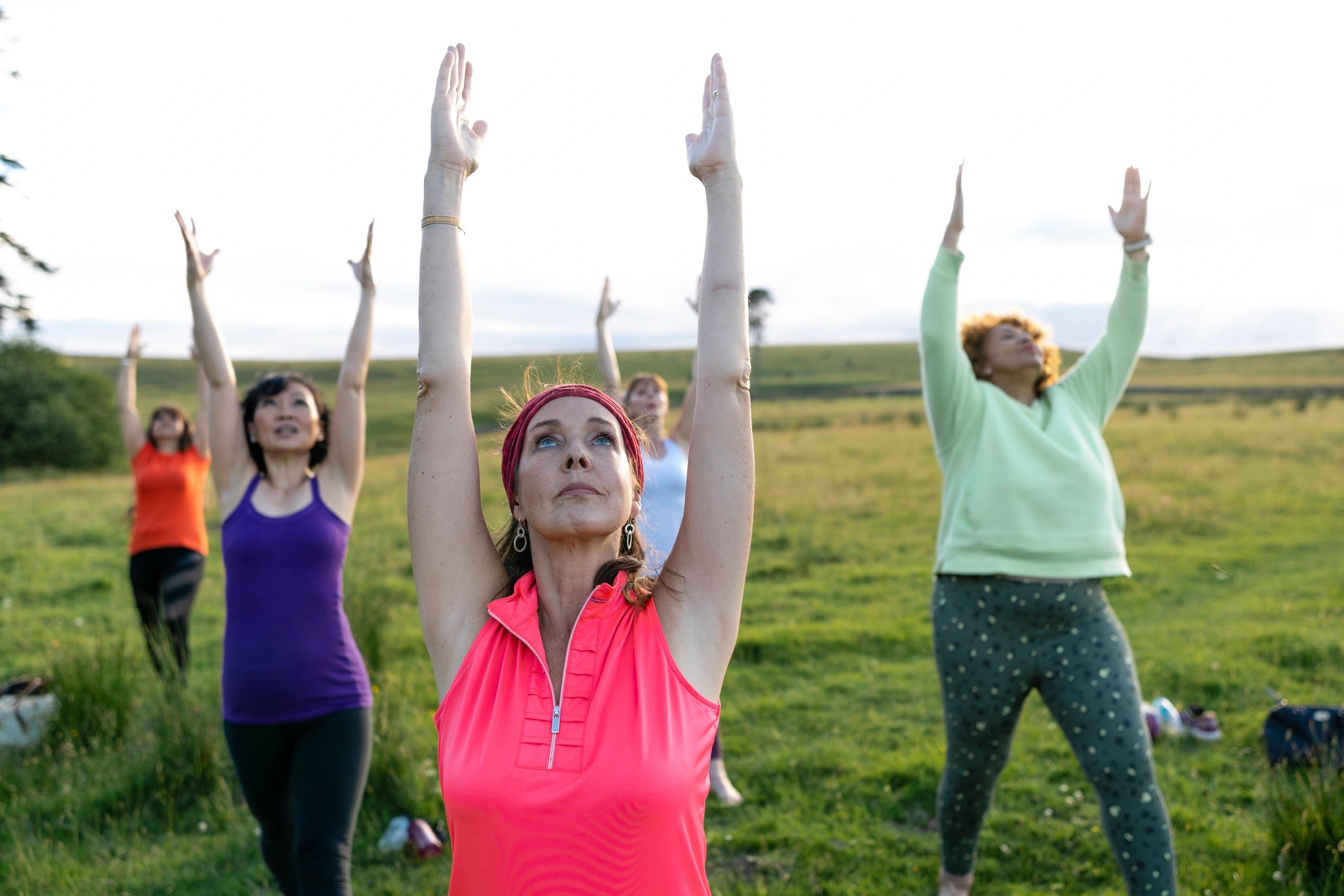 Group practicing mindful movement outdoors